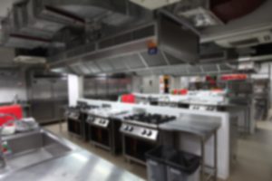 blurry background of kitchen with cooking equipment, Nobody inside.
