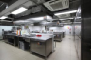 blurry background of kitchen with cooking equipment, Nobody inside.