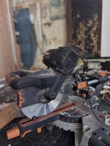 Circular saw in use on a building site during b2b commercial maintenance works.