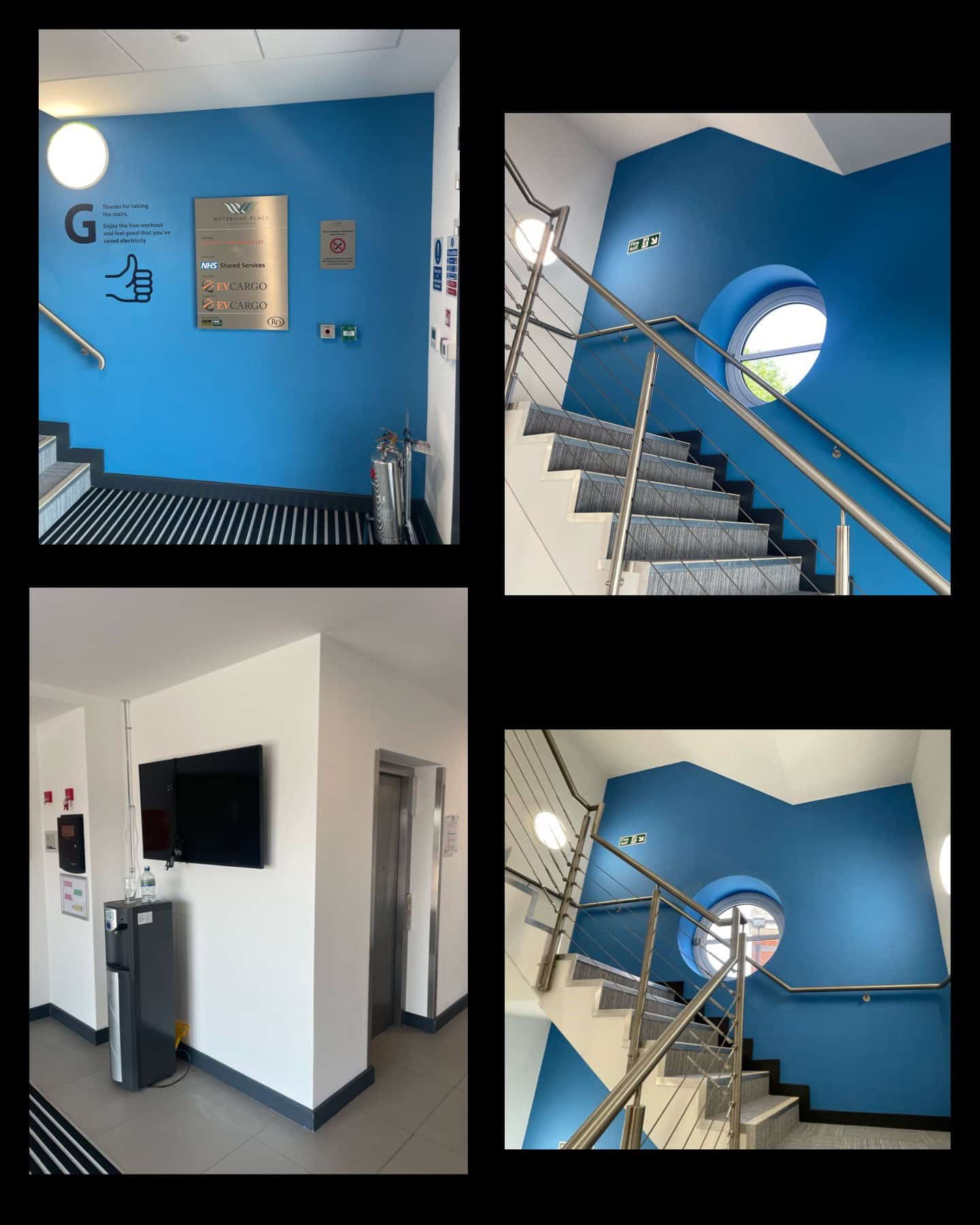 Modern office interior with blue accent walls and staircase